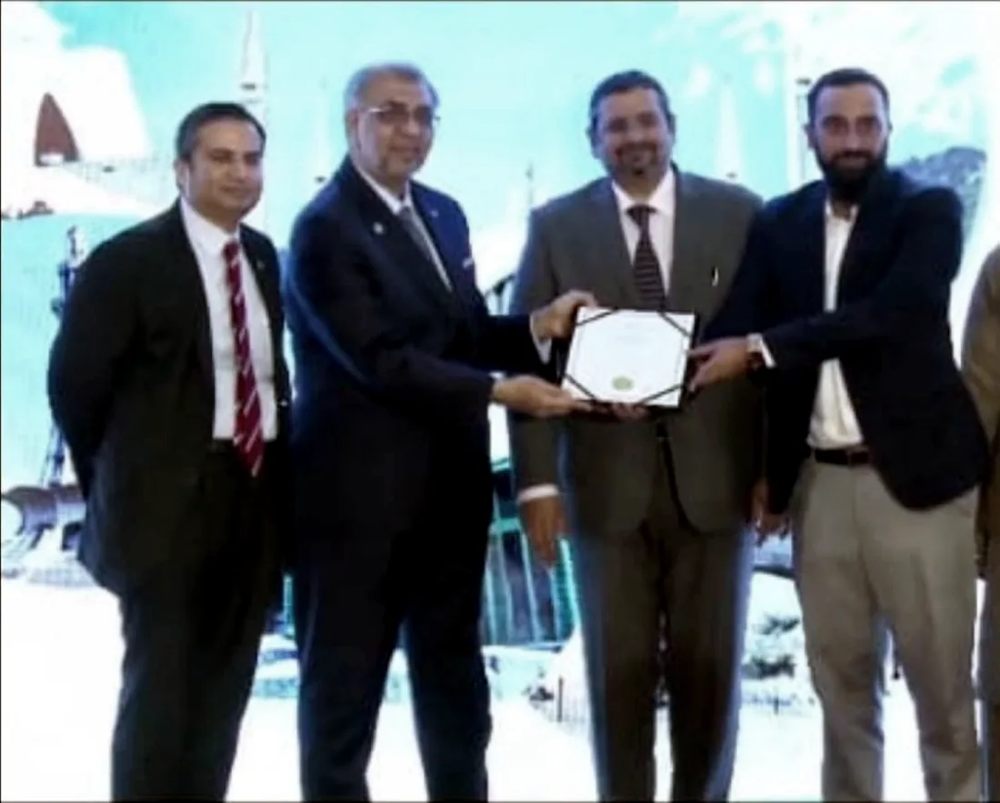 Ahmad Moiz receiving recognition at an Institute of Chartered Accountants of Pakistan event